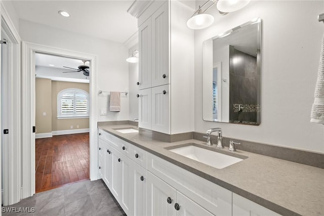 bathroom featuring ceiling fan, tile patterned flooring, and vanity