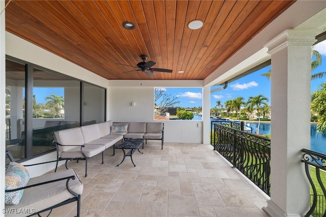 view of patio / terrace featuring outdoor lounge area, ceiling fan, and a balcony