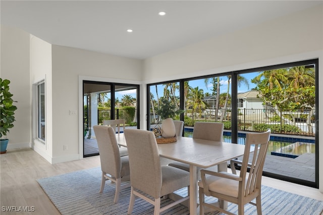 dining space featuring light hardwood / wood-style floors