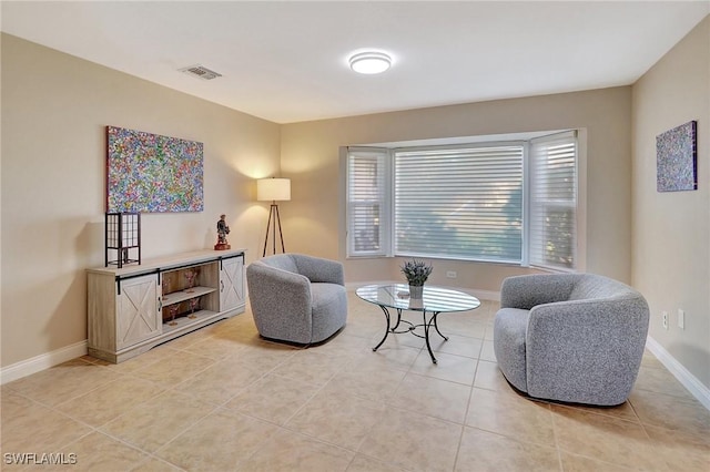 living area featuring light tile patterned floors and a wealth of natural light