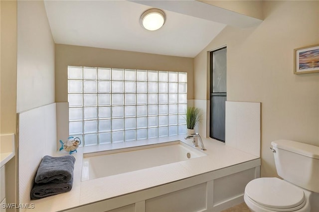 bathroom featuring toilet and a bathtub