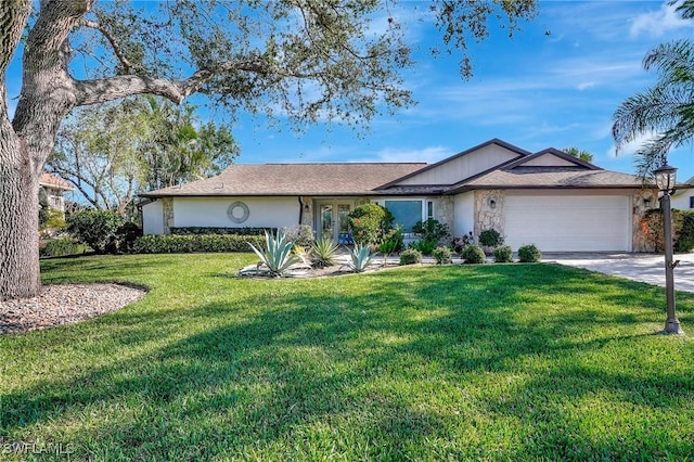 ranch-style house featuring a garage and a front yard