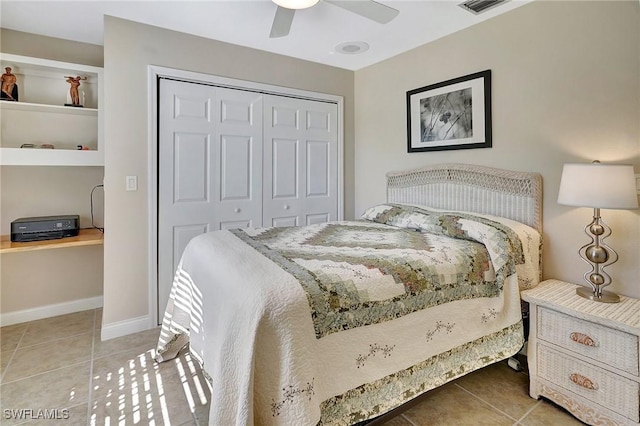 tiled bedroom with a closet and ceiling fan