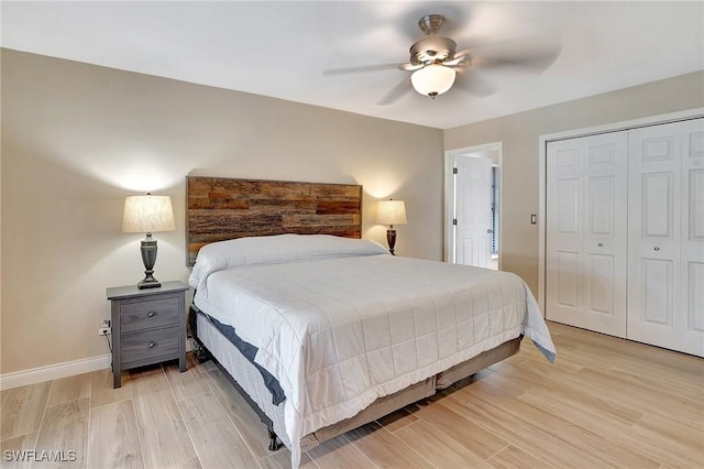 bedroom with ceiling fan and a closet