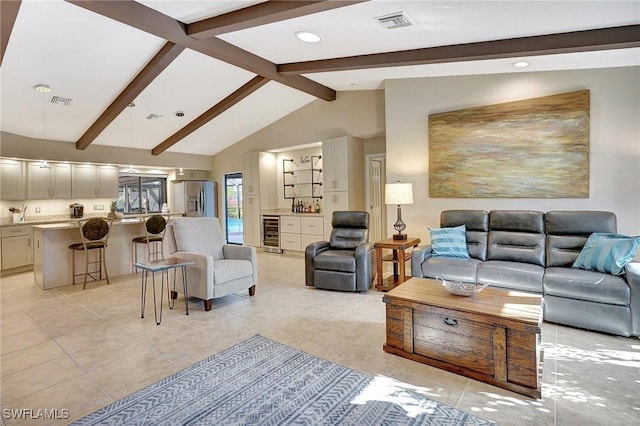 living room featuring high vaulted ceiling, beam ceiling, light tile patterned floors, and beverage cooler