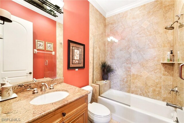 full bathroom featuring toilet, vanity, combined bath / shower with glass door, and crown molding