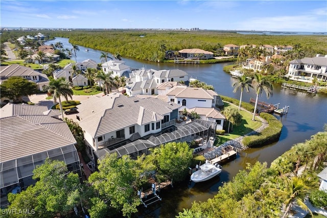 bird's eye view featuring a water view and a residential view