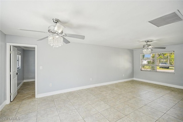 tiled empty room featuring ceiling fan