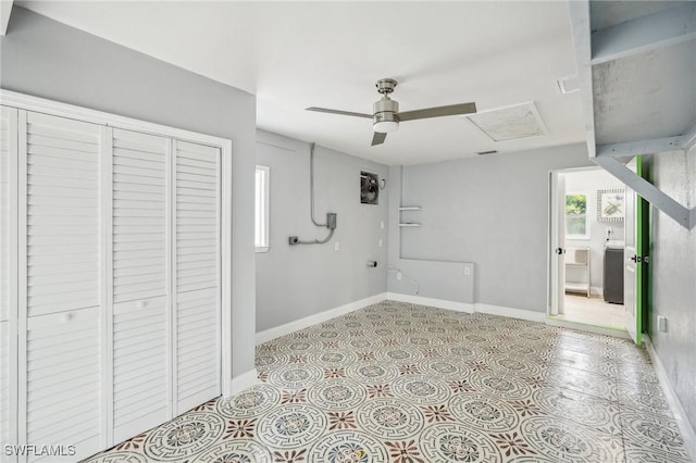 interior space with ceiling fan and a closet