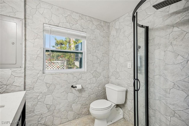 bathroom featuring tile patterned floors, an enclosed shower, vanity, electric panel, and toilet