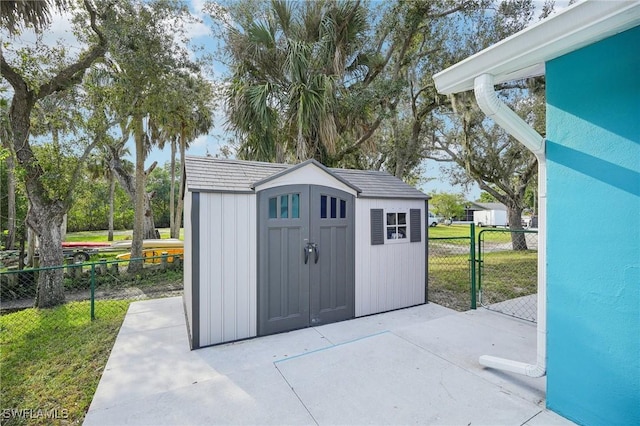 view of outbuilding featuring a lawn