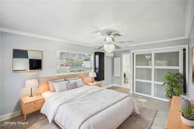 bedroom with ceiling fan, ornamental molding, and ensuite bath