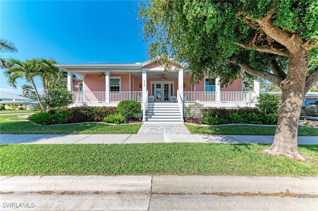 view of front of home with a front lawn and covered porch