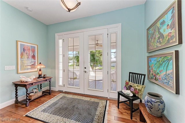 entryway featuring hardwood / wood-style floors and french doors