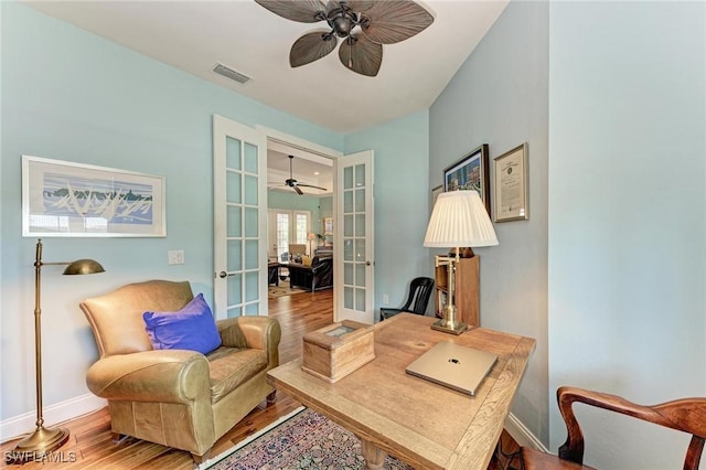 home office featuring french doors and hardwood / wood-style floors