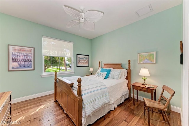 bedroom with ceiling fan and light hardwood / wood-style floors