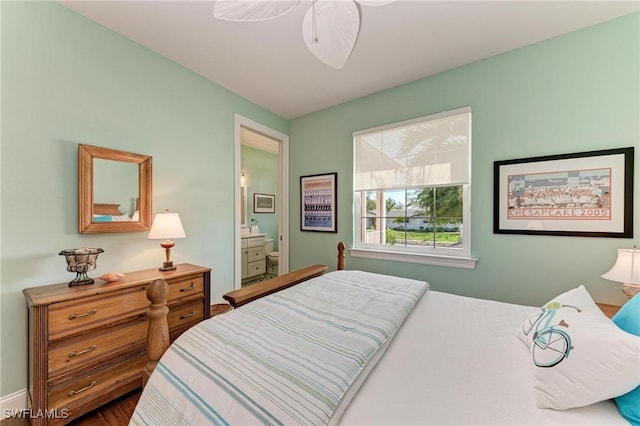 bedroom featuring ensuite bath and ceiling fan