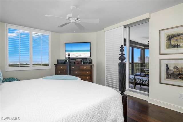 bedroom featuring dark hardwood / wood-style flooring, multiple windows, and ceiling fan