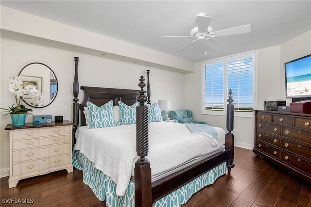 bedroom featuring ceiling fan and dark hardwood / wood-style floors