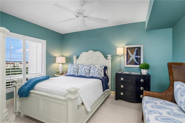 bedroom with light tile patterned floors and ceiling fan