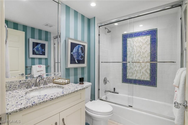 bathroom featuring wallpapered walls, shower / bath combination with glass door, toilet, vanity, and recessed lighting