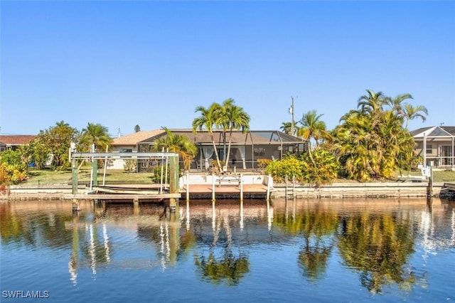 dock area featuring a water view and glass enclosure