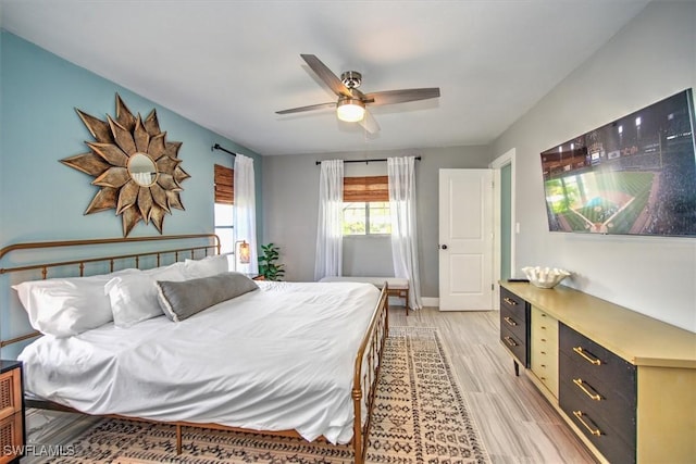 bedroom with ceiling fan and light wood-type flooring