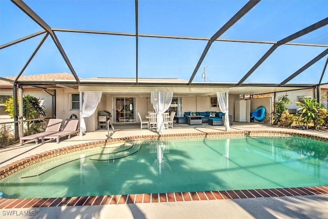 view of pool with outdoor lounge area, a lanai, and a patio area