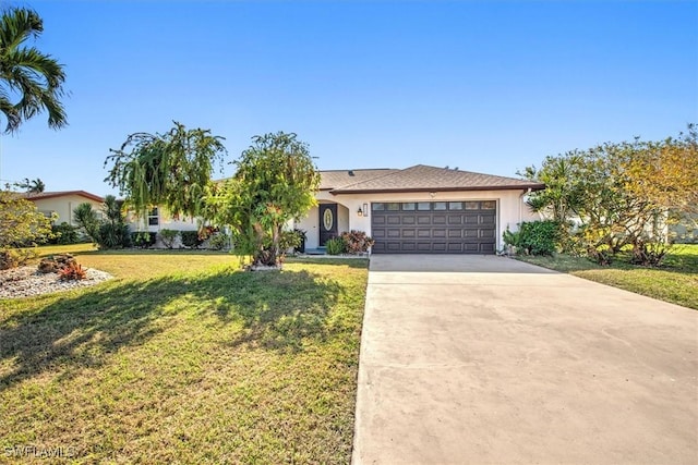 ranch-style house featuring a front yard and a garage