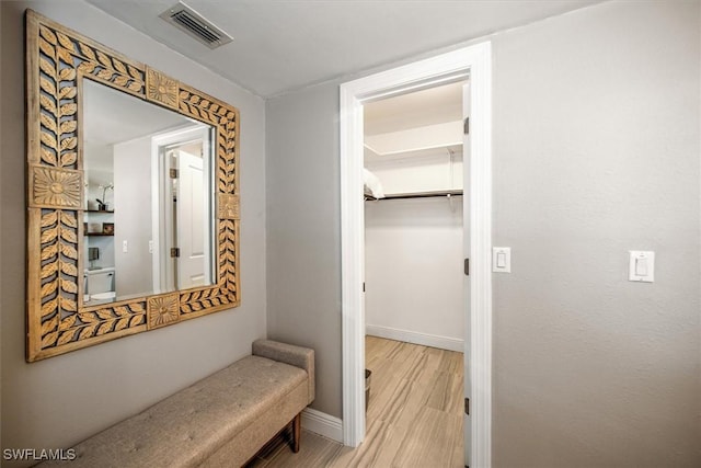 corridor featuring light hardwood / wood-style flooring