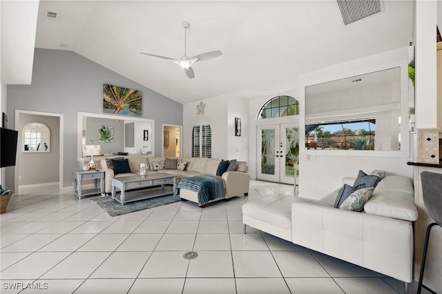 living room featuring ceiling fan, light tile patterned flooring, high vaulted ceiling, and french doors