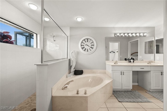 bathroom featuring tile patterned flooring, vanity, and independent shower and bath