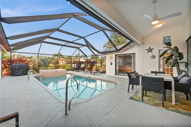 view of swimming pool with a patio, glass enclosure, ceiling fan, and grilling area