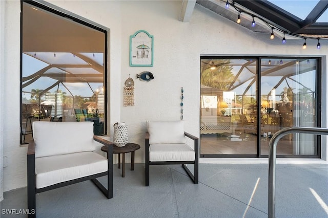 view of patio with a lanai