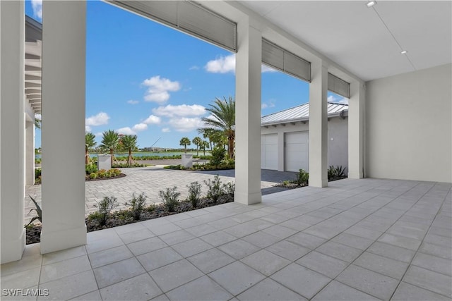 view of patio / terrace featuring a garage