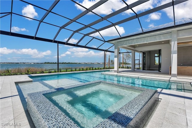 view of swimming pool featuring glass enclosure, a water view, an in ground hot tub, and a patio