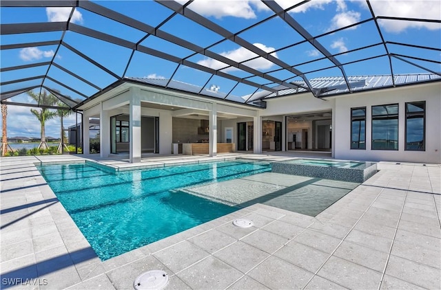 view of pool with ceiling fan, a lanai, an in ground hot tub, and a patio