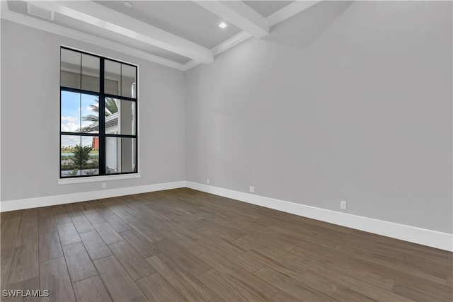 unfurnished room featuring beam ceiling