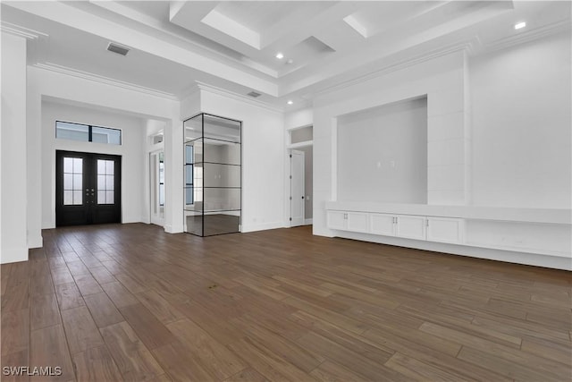 interior space featuring dark hardwood / wood-style floors, a towering ceiling, crown molding, and french doors