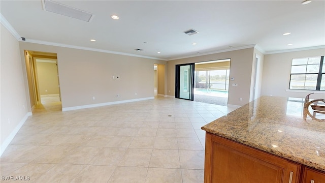 interior space featuring light tile patterned floors and ornamental molding