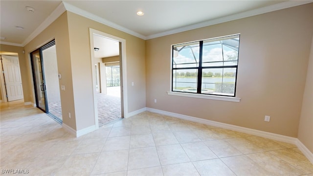 tiled spare room with ornamental molding