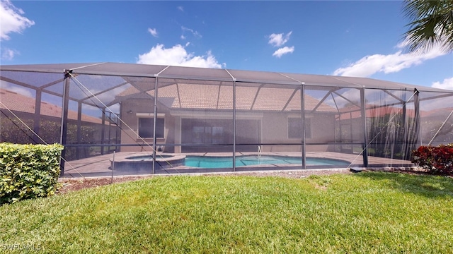 view of swimming pool with a yard and glass enclosure