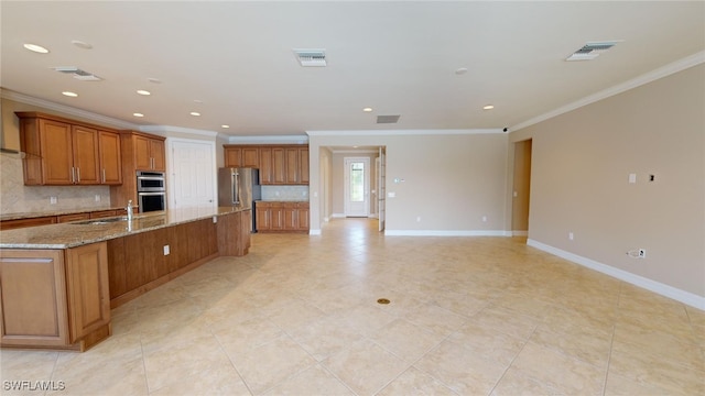 kitchen featuring a large island, tasteful backsplash, light stone counters, ornamental molding, and appliances with stainless steel finishes