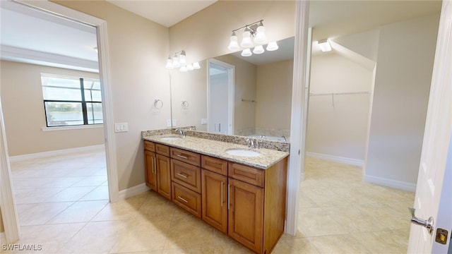 bathroom with tile patterned floors and vanity