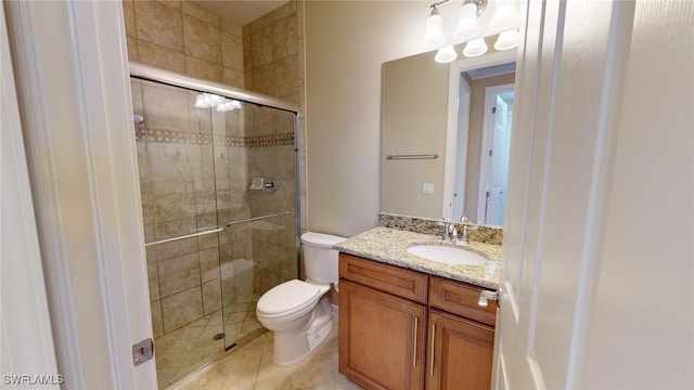 bathroom with walk in shower, tile patterned flooring, vanity, and toilet