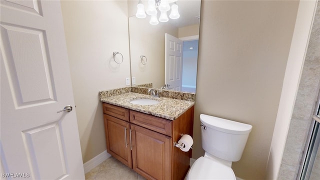 bathroom with tile patterned floors, vanity, and toilet