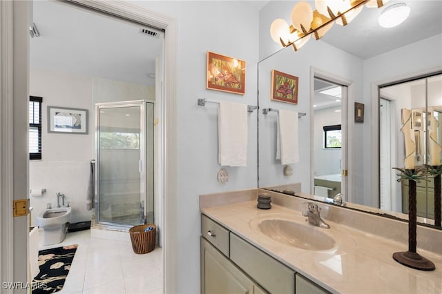 bathroom with tile patterned floors, a bidet, a healthy amount of sunlight, and an enclosed shower