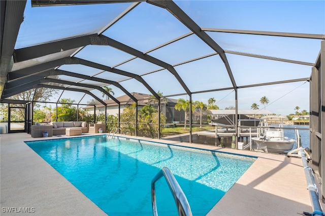 view of pool featuring a lanai, a water view, an outdoor hangout area, and a patio