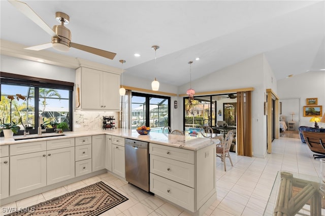 kitchen featuring ceiling fan, sink, stainless steel dishwasher, vaulted ceiling, and decorative backsplash