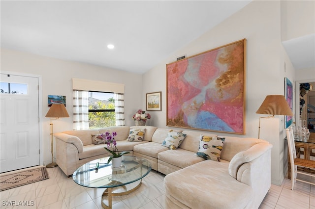 living room featuring vaulted ceiling and light tile patterned flooring